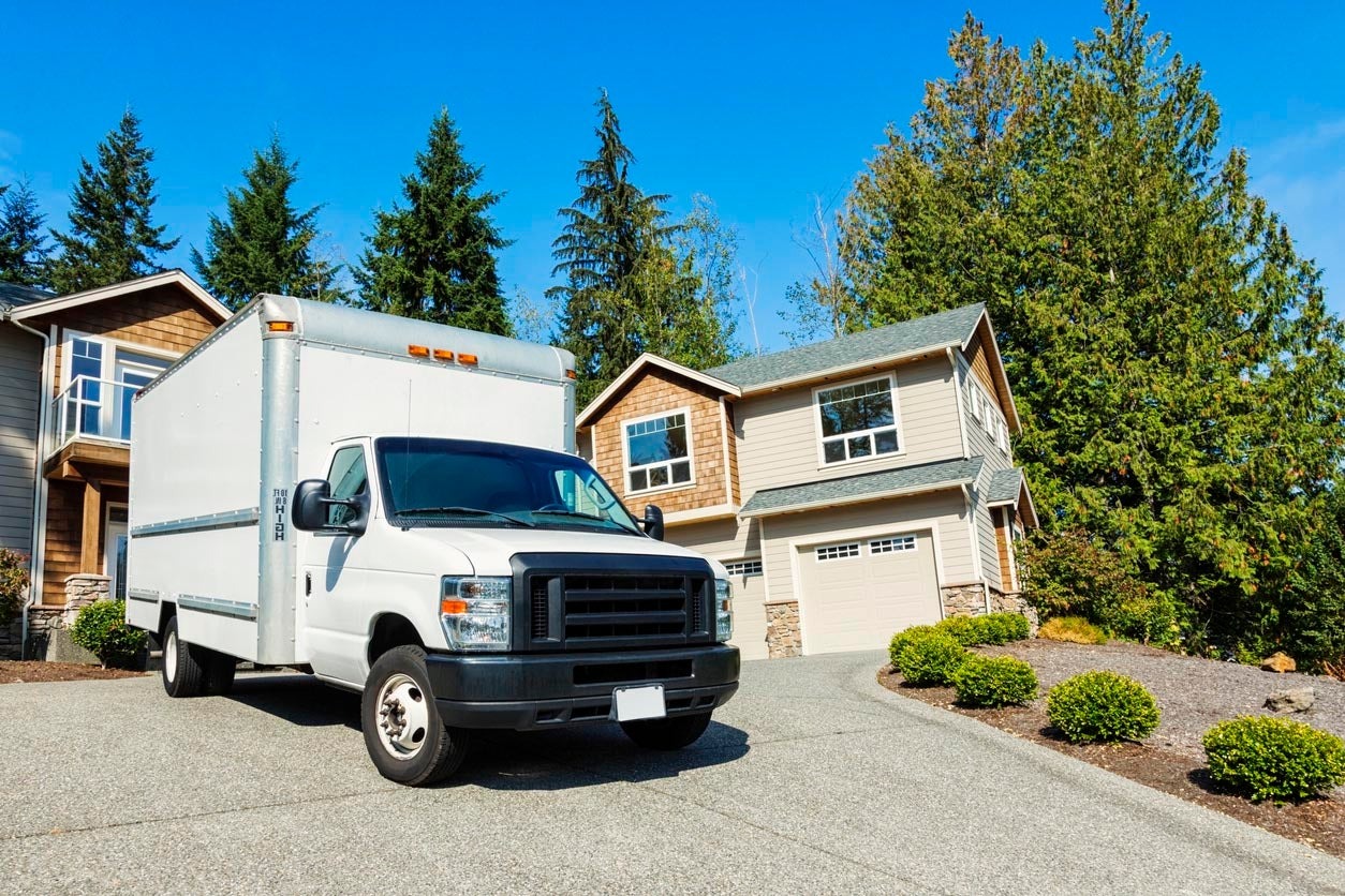 moving truck in-front of a house